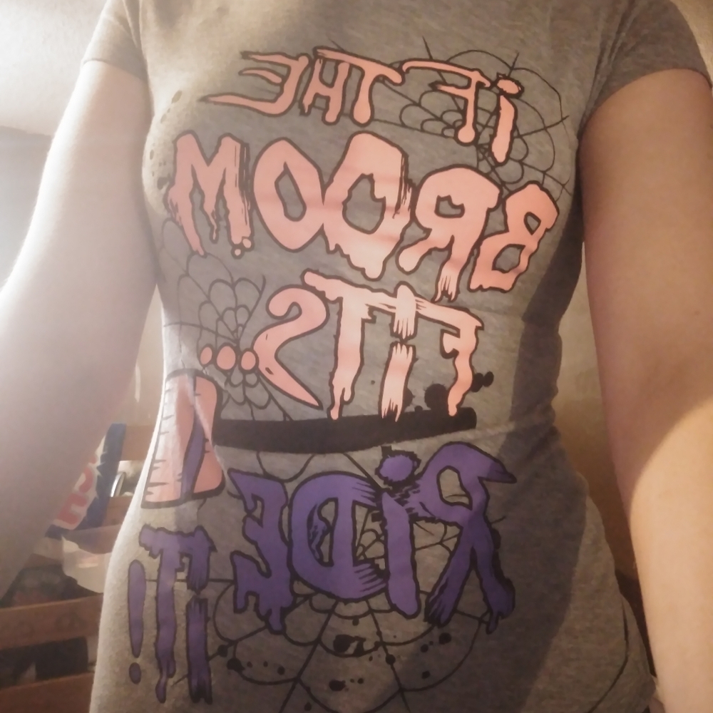 "If the broom fits ride it!" graphic tee